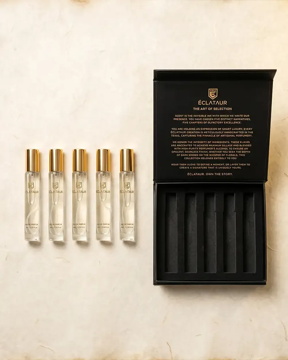 An open ÉCLATAUR Discovery bookcase with five perfume sprays