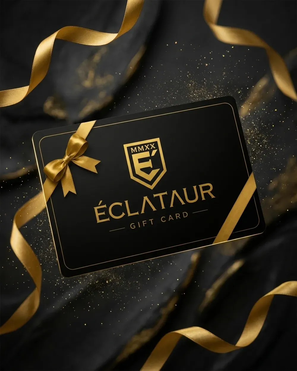 A black and gold ÉCLATAUR gift card on dark marble